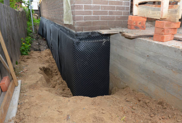 Happy homeowners after waterproofing job in Auburntown